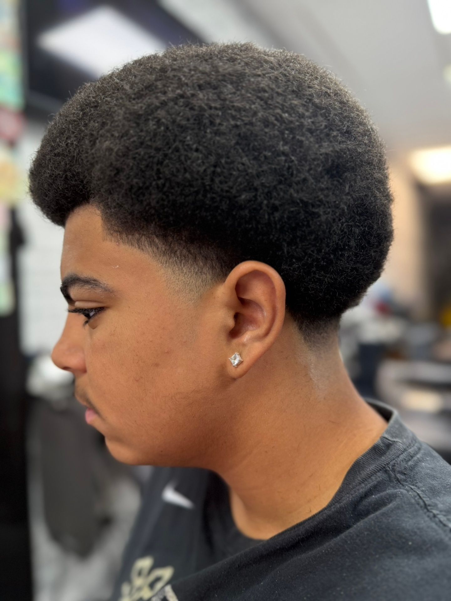 Professional shape-up and blowout hairstyle for men's grooming in Denver