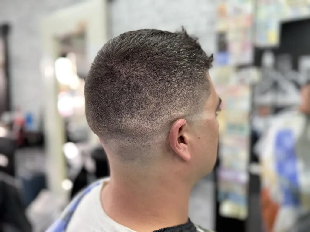Back view of a textured top with a skin fade by a Denver barber near Lowry