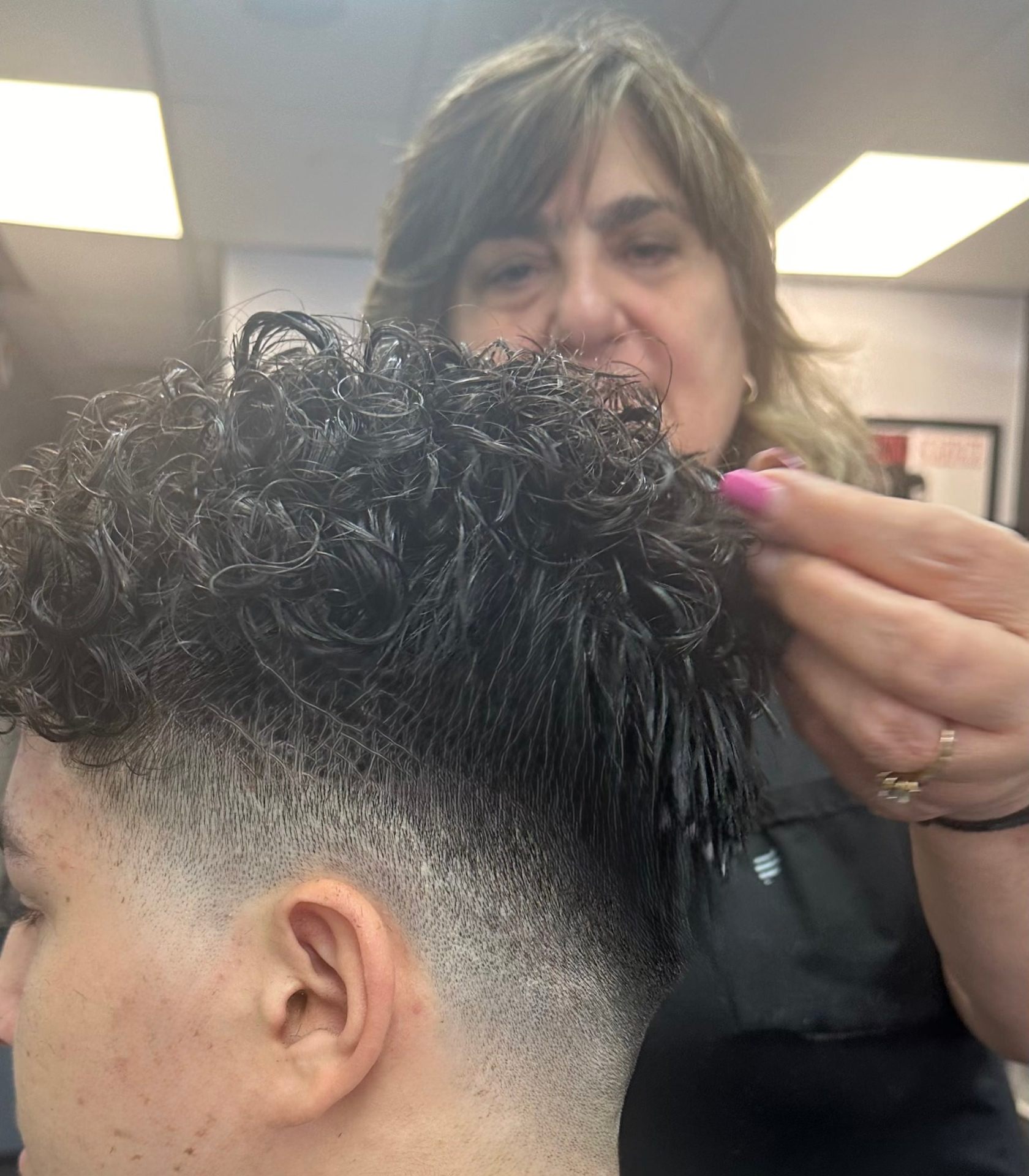 Zoya - Women's Hair Stylist at Wise Guys Barbershop Denver specializing in women's haircuts and kids cuts